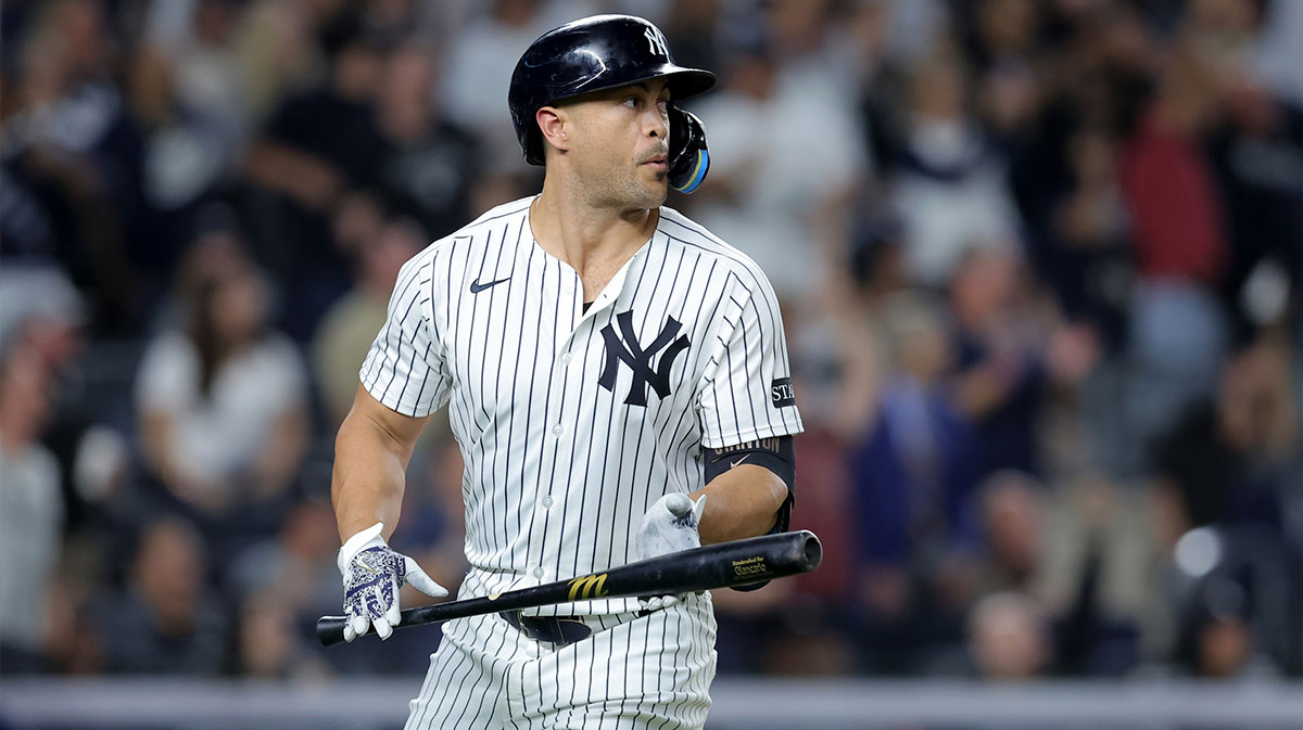 New York Yankees designated hitter Giancarlo Stanton (27) watches his two run home run against the Baltimore Orioles during the third inning at Yankee Stadium.