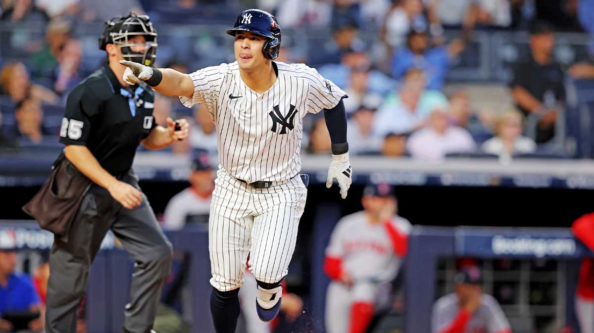 New York Yankees shortstop Anthony Volpe (11) hits a solo home run during the first inning against the Boston Red Sox during game one of the Wildcard round for the 2025 MLB playoffs at Yankee Stadium.