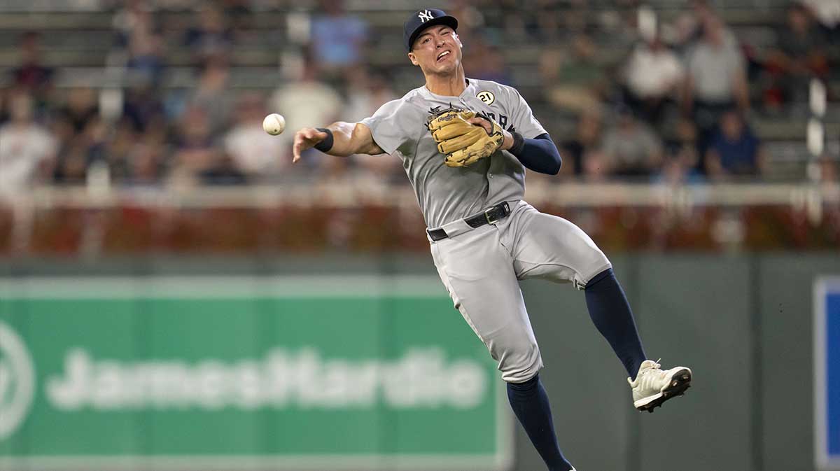 New York Yankees shortstop Anthony Volpe (11) throws the ball to first base against the Minnesota Twins in the eighth inning at Target Field.