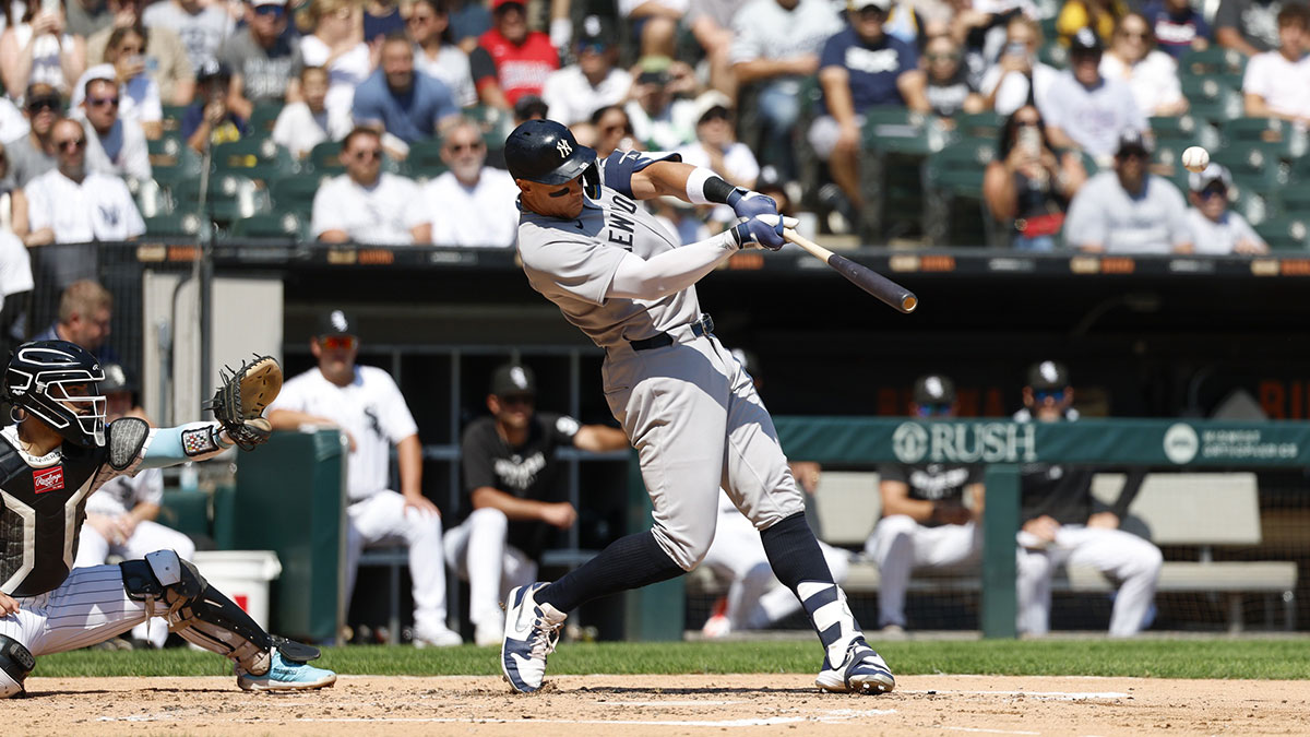 New York Yankees designated hitter Aaron Judge (99) hits a double against the Chicago White Sox during the third inning at Rate Field.