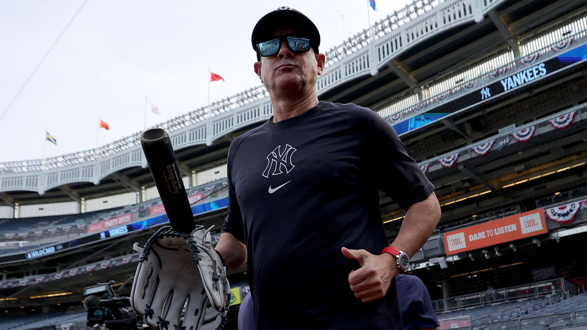 New York Yankees manager Aaron Boone (17) watches batting practice before game one of the Wildcard round of the 2025 MLB playoffs against the Boston Red Sox at Yankee Stadium.