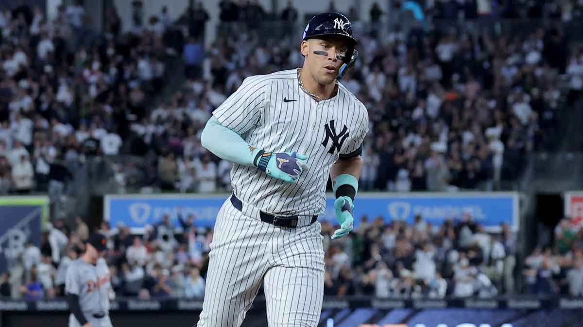 New York Yankees right fielder Aaron Judge (99) rounds the bases after hitting a solo home run against the Detroit Tigers during the first inning at Yankee Stadium.