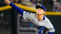 Los Angeles Dodgers pitcher Yoshinobu Yamamoto (18) throws to the Arizona Diamondbacks