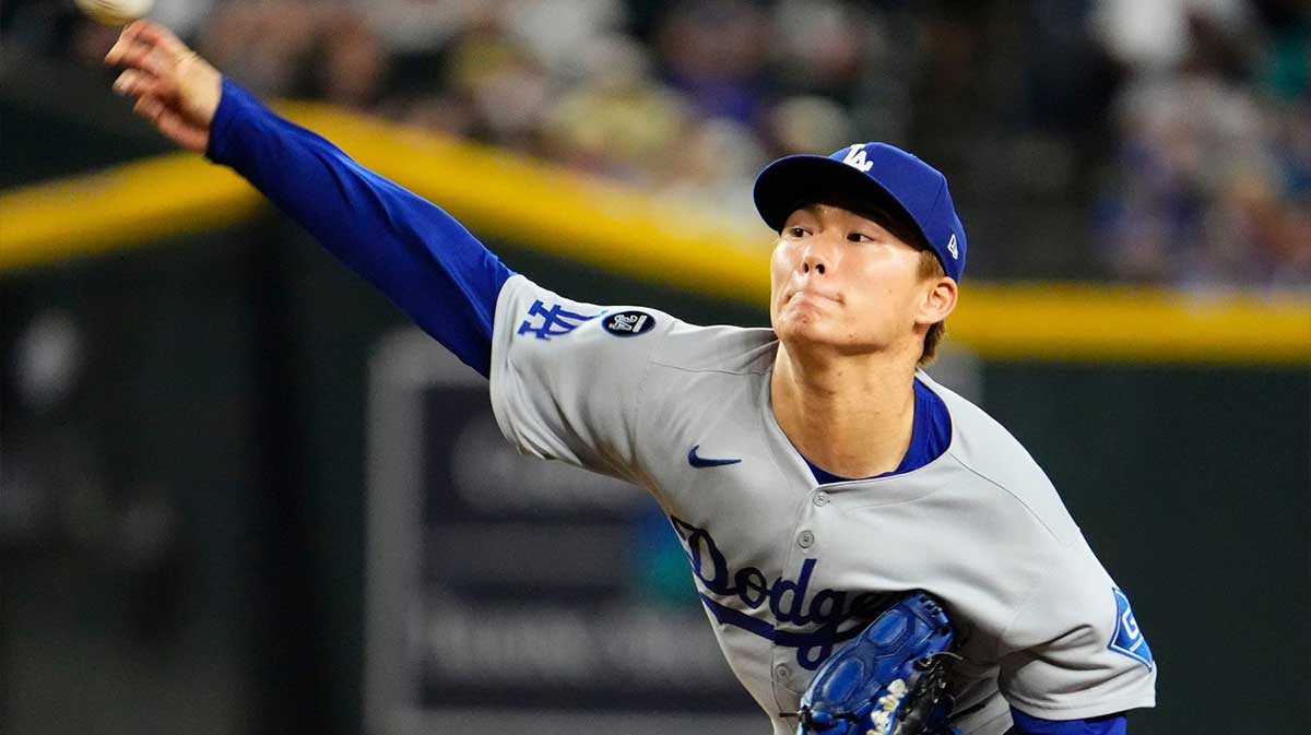 Los Angeles Dodgers pitcher Yoshinobu Yamamoto (18) throws to the Arizona Diamondbacks in the first inning during the season home finale at Chase Field in Phoenix on Sept. 25, 2025.