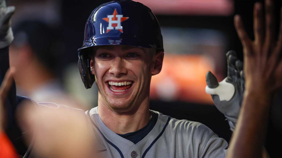 Houston Astros left fielder Zach Cole (16) celebrates with teammates after a two-run home run against the Atlanta Braves in the third inning at Truist Park.