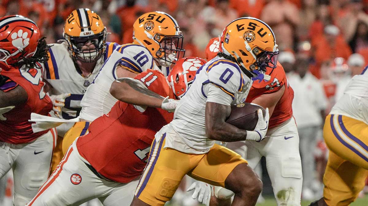 Louisiana State University receiver Zavion Thomas (0) runs near Clemson defensive lineman Peter Woods (11) during the first quarter at Memorial Stadium in Clemson, S.C. Saturday, August 30, 2025.