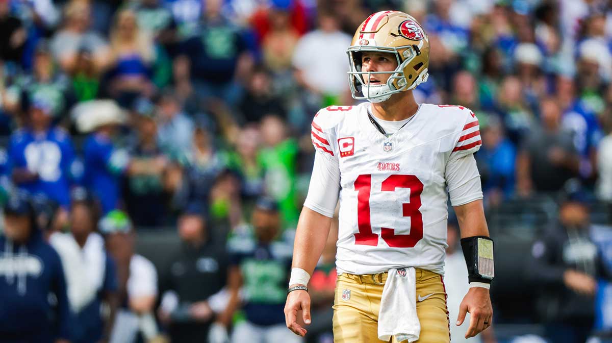 San Francisco 49ers quarterback Brock Purdy (13) reacts following a failed third down play against the Seattle Seahawks during the fourth quarter at Lumen Field
