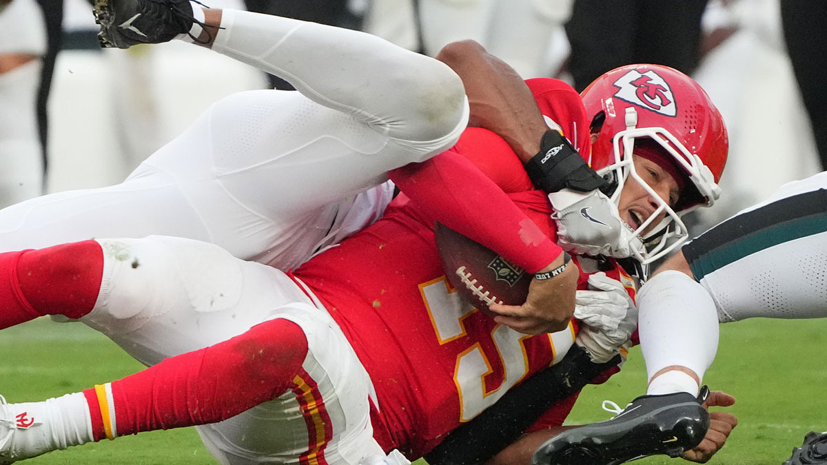 Philadelphia Eagles defensive tackle Moro Ojomo (97) sacks Kansas City Chiefs quarterback Patrick Mahomes (15) during the fourth quarter of the game at GEHA Field at Arrowhead Stadium.