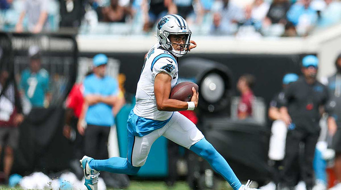 Carolina Panthers quarterback Bryce Young (9) carries the ball against the Jacksonville Jaguars during the first half at EverBank Stadium.