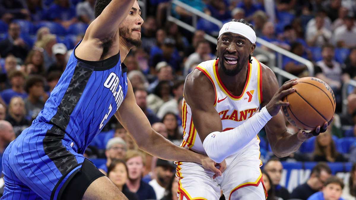 Orlando Magic guard Caleb Houstan (2) guards Atlanta Hawks guard Caris LeVert (3) in the first quarter at Kia Center.