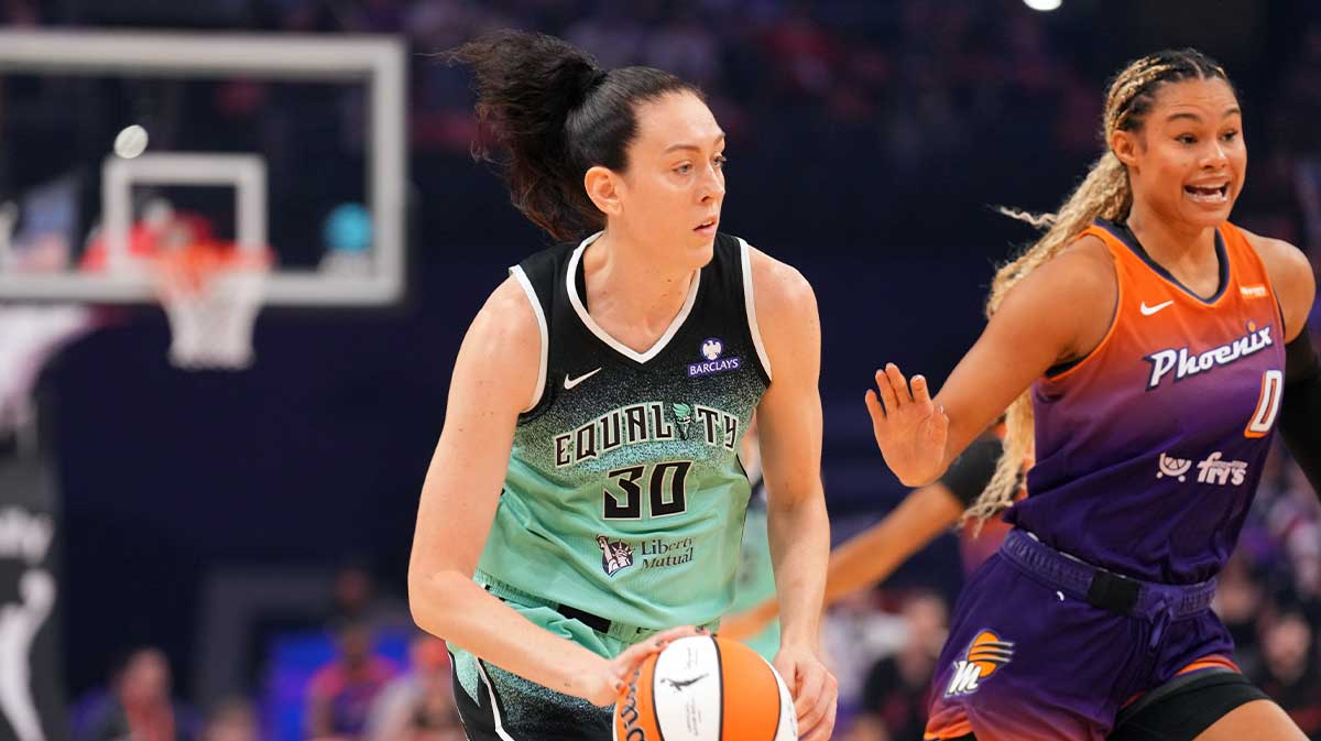 Sep 19, 2025; Phoenix, Arizona, USA; New York Liberty forward Breanna Stewart (30) dribbles by Phoenix Mercury forward Satou Sabally (0) during the first half of game three of round one for the 2025 WNBA Playoffs at PHX Arena. Mandatory Credit: Joe Camporeale-Imagn Images