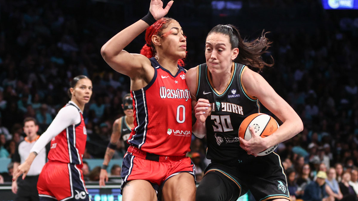 Sep 9, 2025; Brooklyn, New York, USA; New York Liberty forward Breanna Stewart (30) looks to drive past Washington Mystics forward Shakira Austin (0) in the third quarter at Barclays Center. Mandatory Credit: Wendell Cruz-Imagn Images