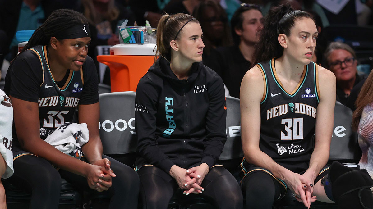 Sep 17, 2025; Brooklyn, New York, USA; New York Liberty center Jonquel Jones (35), guard Sabrina Ionescu (20), and forward Breanna Stewart (30) watch from the bench against the Phoenix Mercury during game two of round one for the 2025 WNBA Playoffs at Barclays Center. Mandatory Credit: Wendell Cruz-Imagn Images