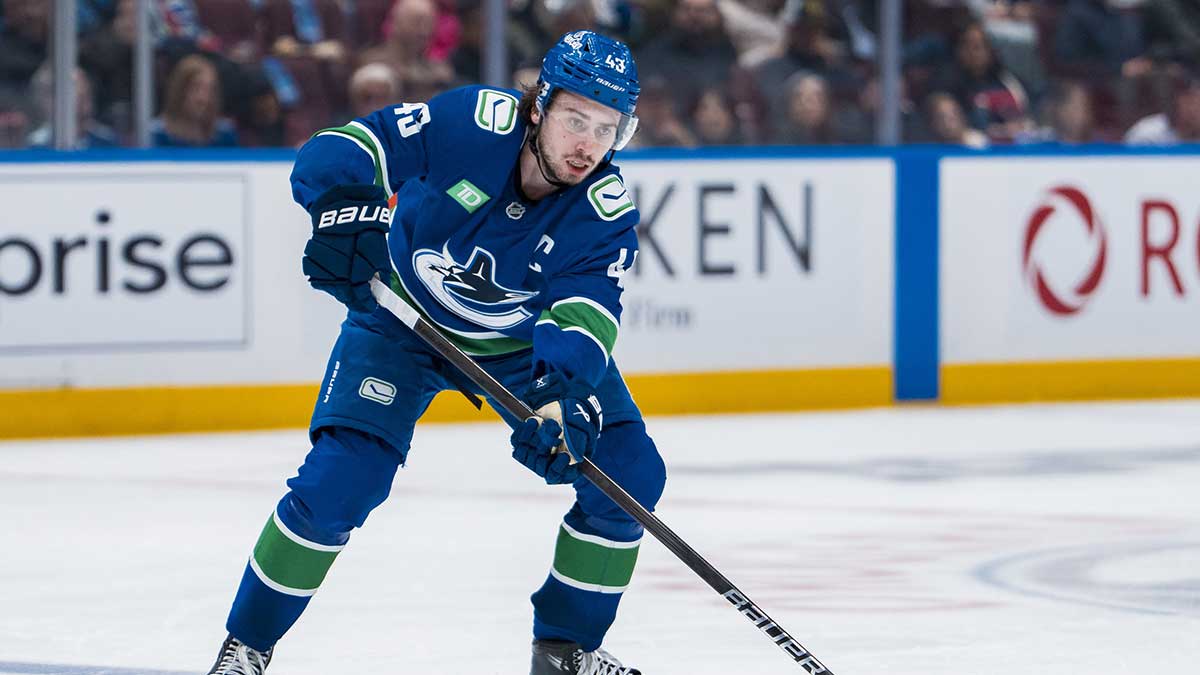Vancouver Canucks defenseman Quinn Hughes (43) handles the puck against the Minnesota Wild in the second period at Rogers Arena.
