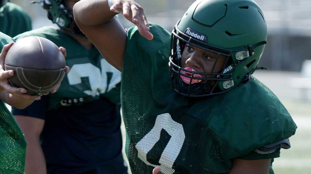 Running back Isaiah Phelps takes a handoff during a Pacifica High football practice on Tuesday, Aug. 12, 2025. The Tritons, who won a CIF-SS title and reached a state bowl game last season, open the 2025 season at home against West Ranch on Aug. 22.