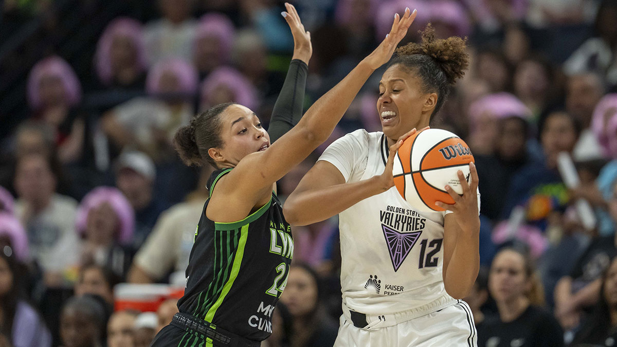 Golden State Valkyries center Iliana Rupert (12) passes around Minnesota Lynx forward Napheesa Collier (24) in the second half at Target Center.