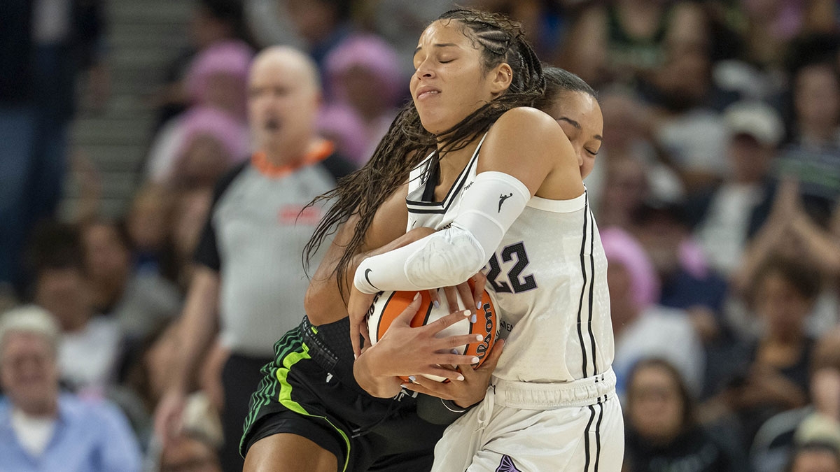 Golden State Valkyries guard Veronica Burton (22) and Minnesota Lynx forward Napheesa Collier (24) fight for the ball in the second half at Target Center.