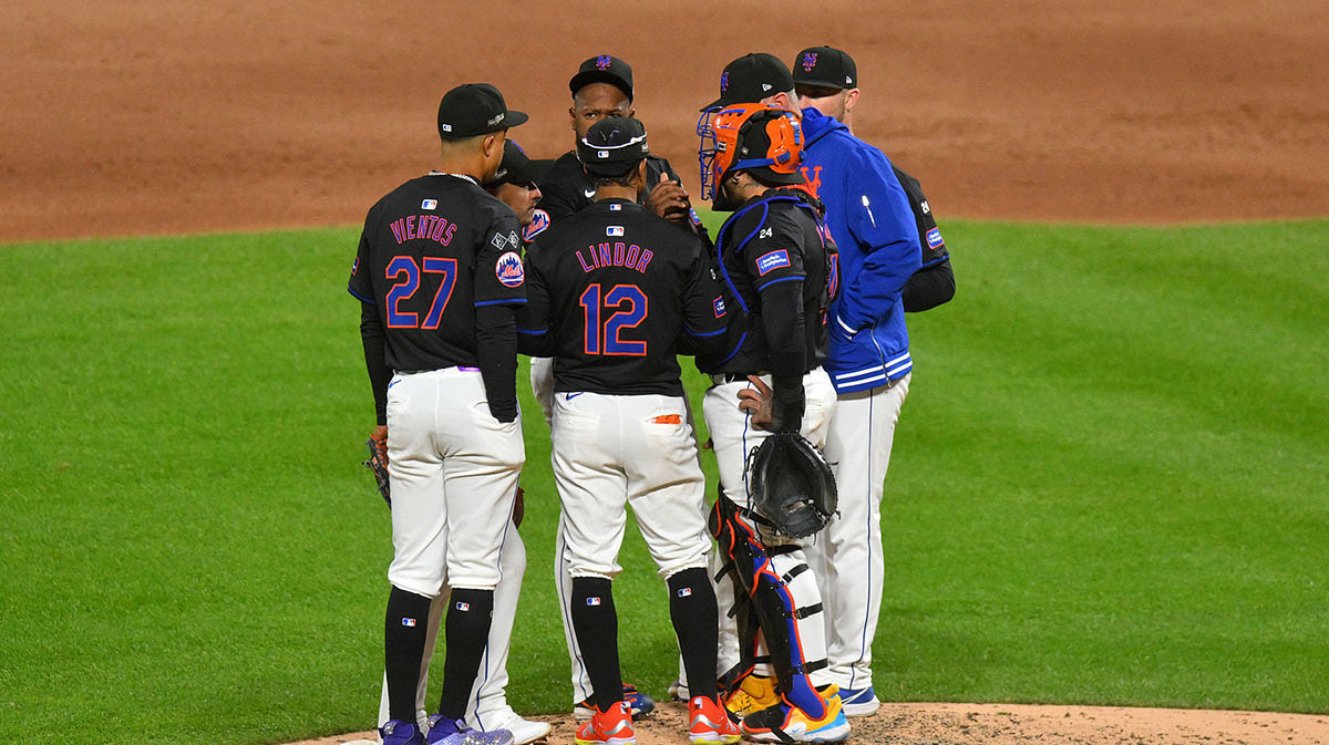 New York Mets pitcher Luis Severino (40) and players meet at the mound against the Los Angeles Dodgers in the third inning during game three of the NLCS for the 2024 MLB playoffs at Citi Field.