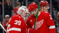 Detroit Red Wings goaltender Cam Talbot (39) and left wing James van Riemsdyk (21) celebrate after defeating the Florida Panthers at Little Caesars Arena.
