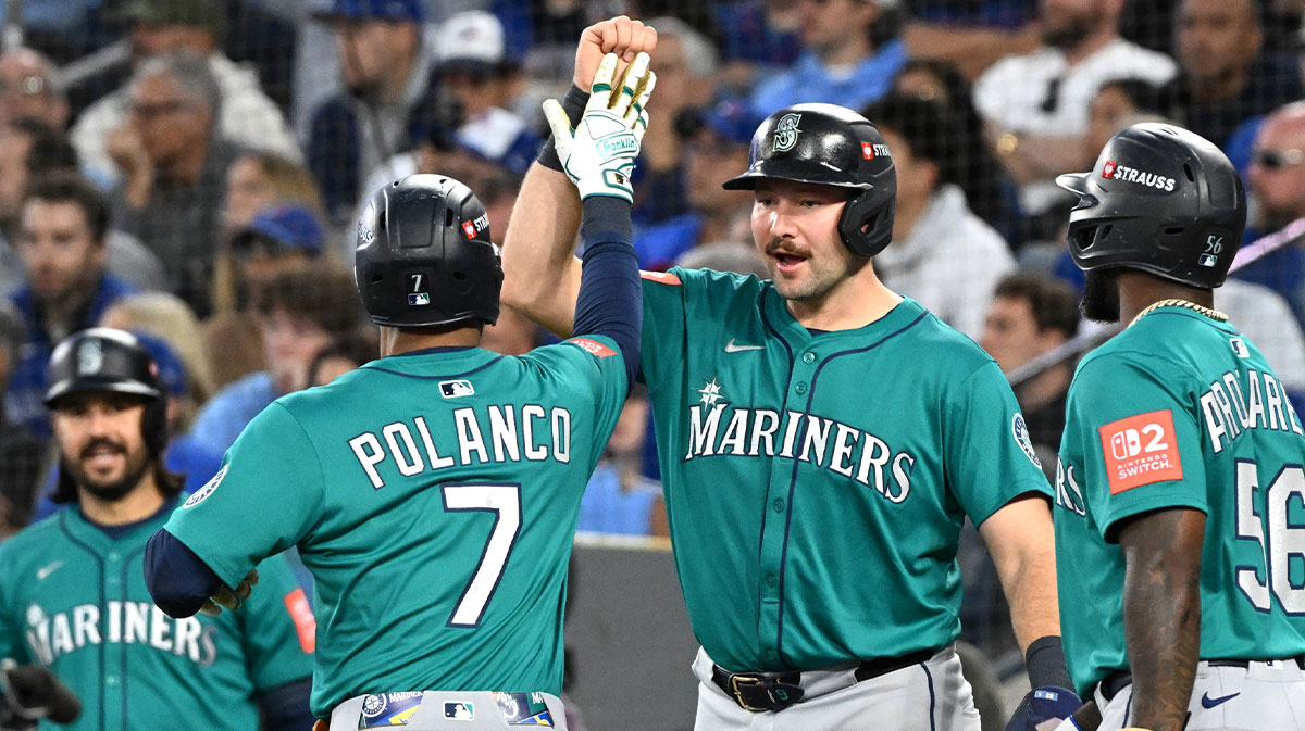 Seattle Mariners second baseman Jorge Polanco (7) celebrates with catcher Cal Raleigh (29) after hitting a three run home run against the Toronto Blue Jays in the fifth inning during game two of the ALCS round for the 2025 MLB playoffs at Rogers Centre.