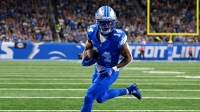 Detroit Lions wide receiver Amon-Ra St. Brown (14) catches a touchdown pass during the first half against the Cleveland Browns at Ford Field.