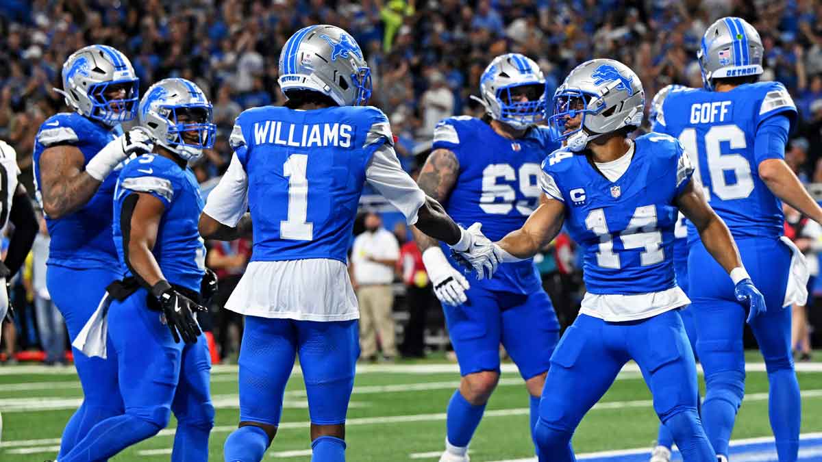 Detroit Lions wide receiver Amon-Ra St. Brown (14) celebrates after catching a touchdown pass during the first half against the Cleveland Browns at Ford Field.
