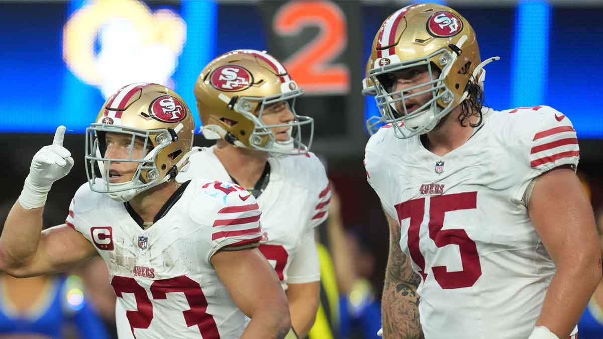 San Francisco 49ers running back Christian McCaffrey (23) reacts after scoring a touchdown against the Los Angeles Rams during the first half at SoFi Stadium.
