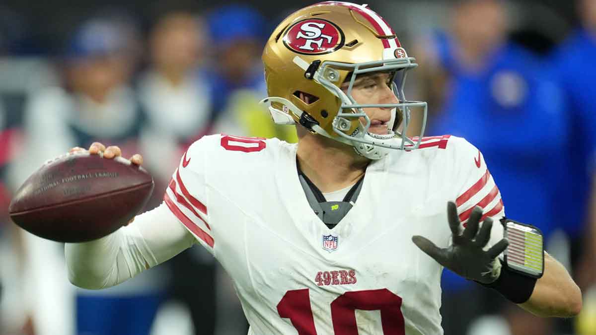 San Francisco 49ers quarterback Mac Jones (10) drops back to pass against the Los Angeles Rams during the first half at SoFi Stadium.