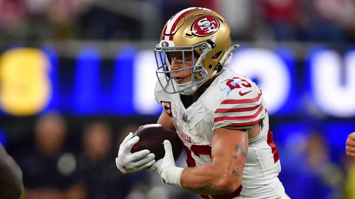 San Francisco 49ers running back Christian McCaffrey (23) rushes the ball against the Los Angeles Rams during the first half at SoFi Stadium.