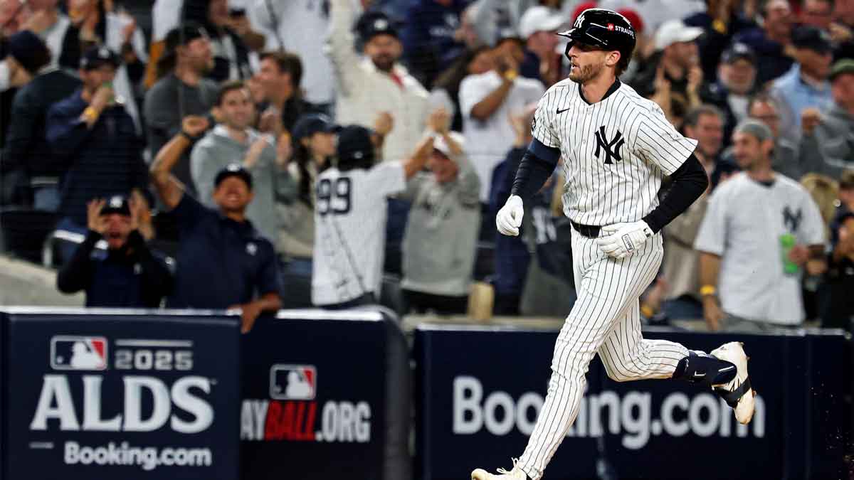 New York Yankees third baseman Ryan McMahon (19) hits a solo home run during the third inning against the Toronto Blue Jays during game four of the ALDS round for the 2025 MLB playoffs at Yankee Stadium.
