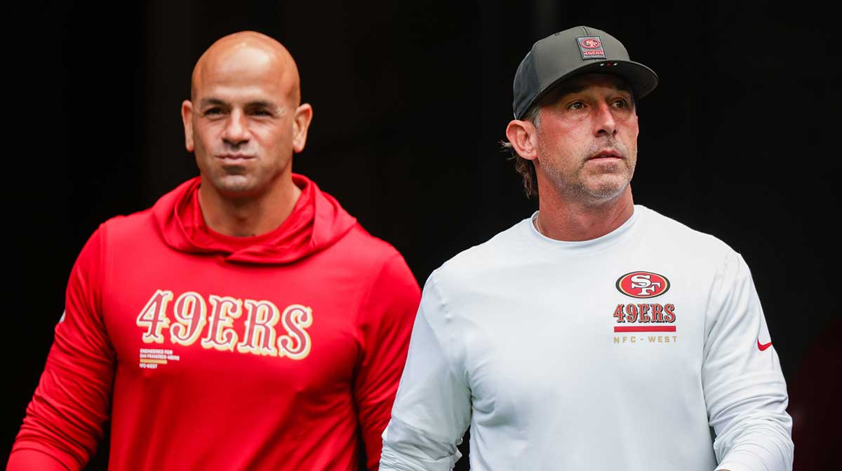 San Francisco 49ers defensive coordinator Robert Saleh, left, and head coach Kyle Shanahan, right, exit the locker room during pregame warmups against the Seattle Seahawks at Lumen Field.