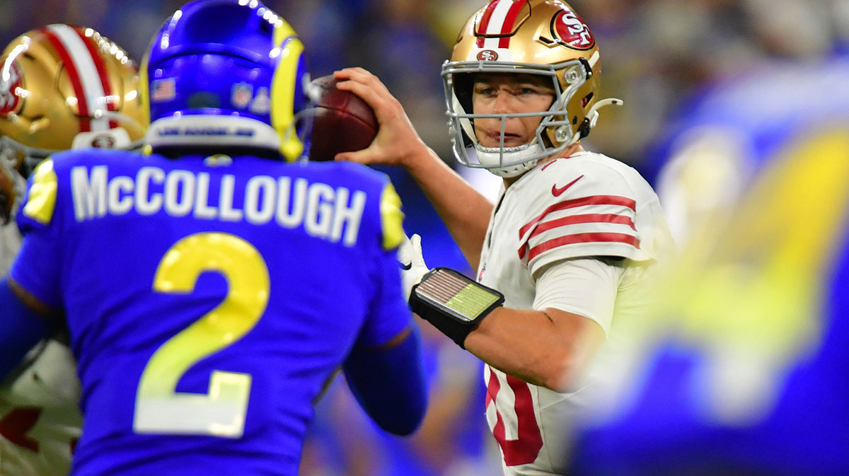 San Francisco 49ers quarterback Mac Jones (10) drops back to pass against the Los Angeles Rams during overtime at SoFi Stadium.