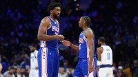 76ers center Joel Embiid (21) reacts with guard Tyrese Maxey (0) against the Dallas Mavericks in the second quarter at Wells Fargo Center