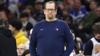 76ers head coach Nick Nurse looks on during the third quarter against the Toronto Raptors at Wells Fargo Center with ESPN's Brian Windhorst in the background
