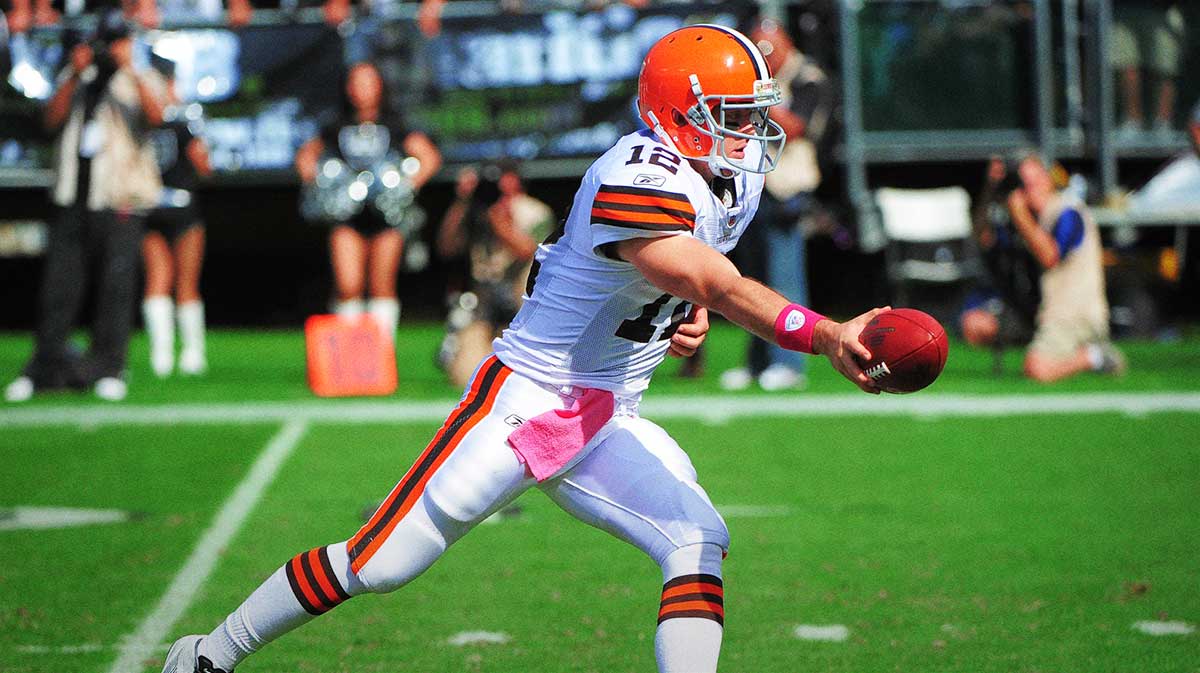 Cleveland Browns quarterback Colt McCoy (12) hands the ball off during the second quarter against the Oakland Raiders at O.co Coliseum. The Raiders defeated the Browns 24-17.