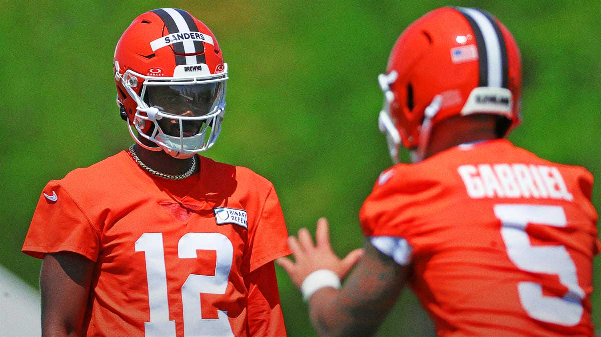 Cleveland Browns quarterback Shedeur Sanders (12) watches quarterback Dillon Gabriel (5) during day two of rookie minicamp May 10, 2025, in Berea, Ohio.