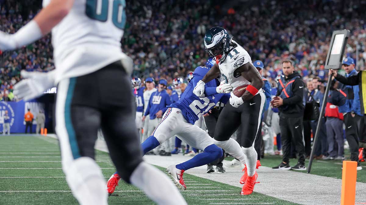 New York Giants cornerback Paulson Adebo (21) pushes Philadelphia Eagles wide receiver A.J. Brown (11) out of bounds during the second quarter of the game at MetLife Stadium.
