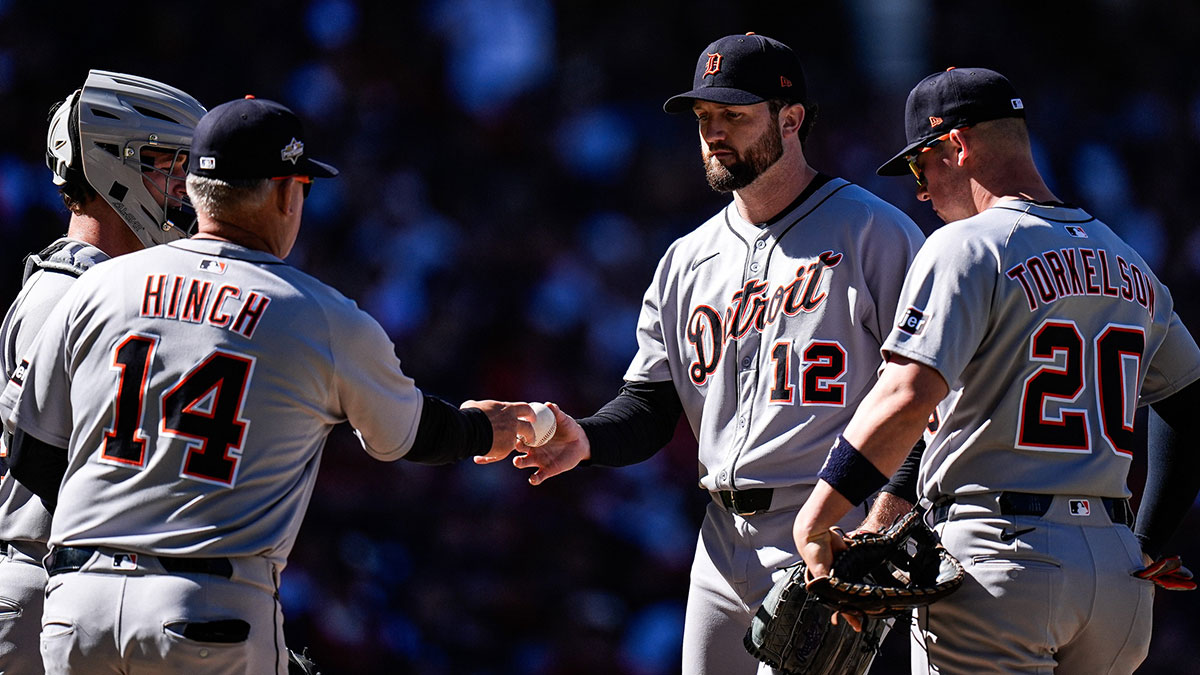 Detroit Tigers pitcher Casey Mize (12) hands the ball to manager A.J. Hinch (14) for pitching change during the fourth inning of Game 2 of AL wild-card series at Progressive Field in Cleveland, Ohio on Wednesday, Oct. 1, 2025.