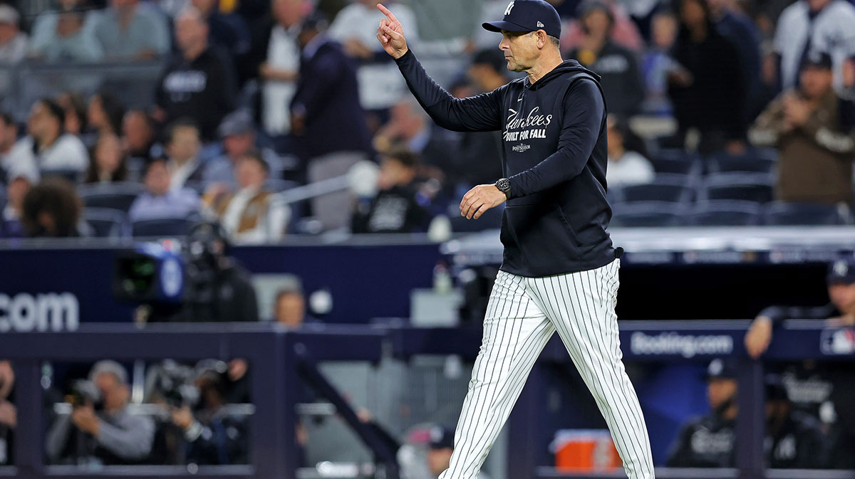 New York Yankees manager Aaron Boone signals to the bullpen during the seventh inning against the Toronto Blue Jays during game four of the ALDS round for the 2025 MLB playoffs at Yankee Stadium.