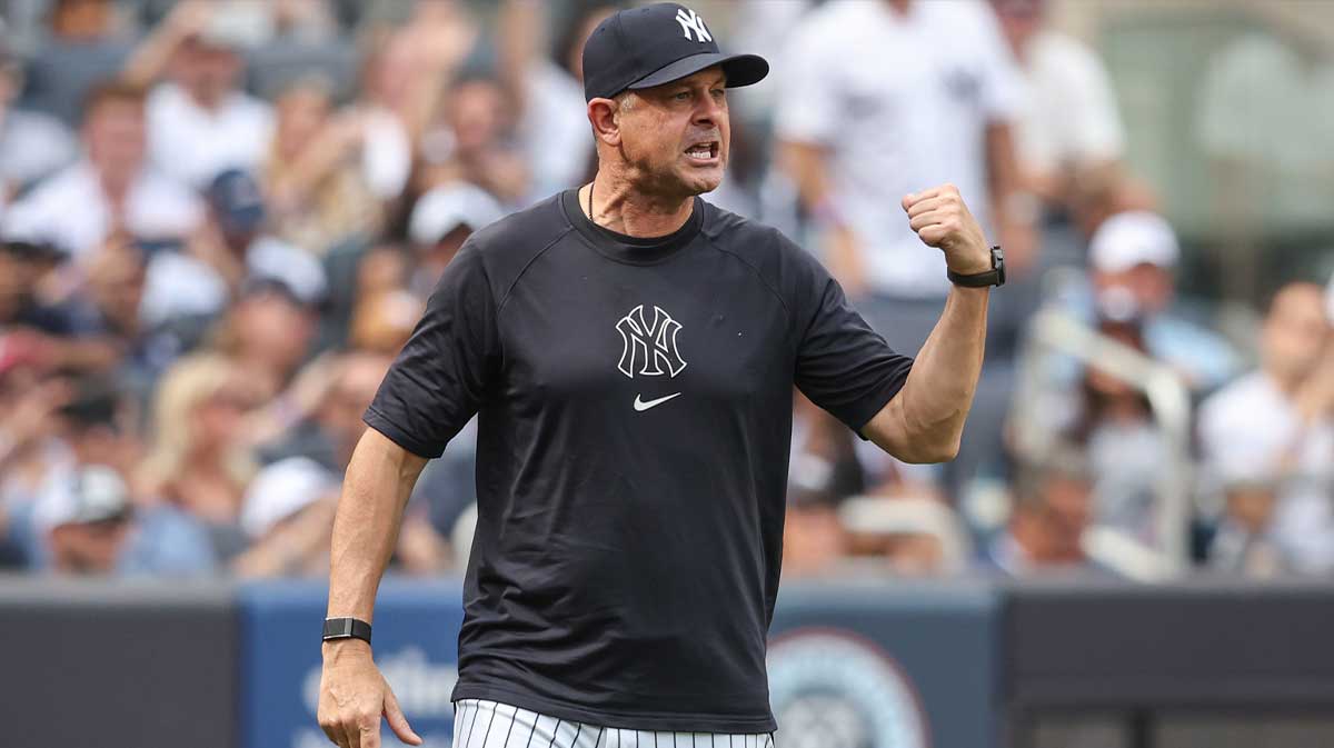 New York Yankees manager Aaron Boone (17) argues with first base umpire Dan Iassogna (58) in the fifth inning against the Baltimore Orioles at Yankee Stadium.