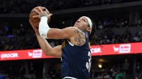 Denver Nuggets forward Aaron Gordon (32) dunks the ball during the first half against the Phoenix Suns at Ball Arena.