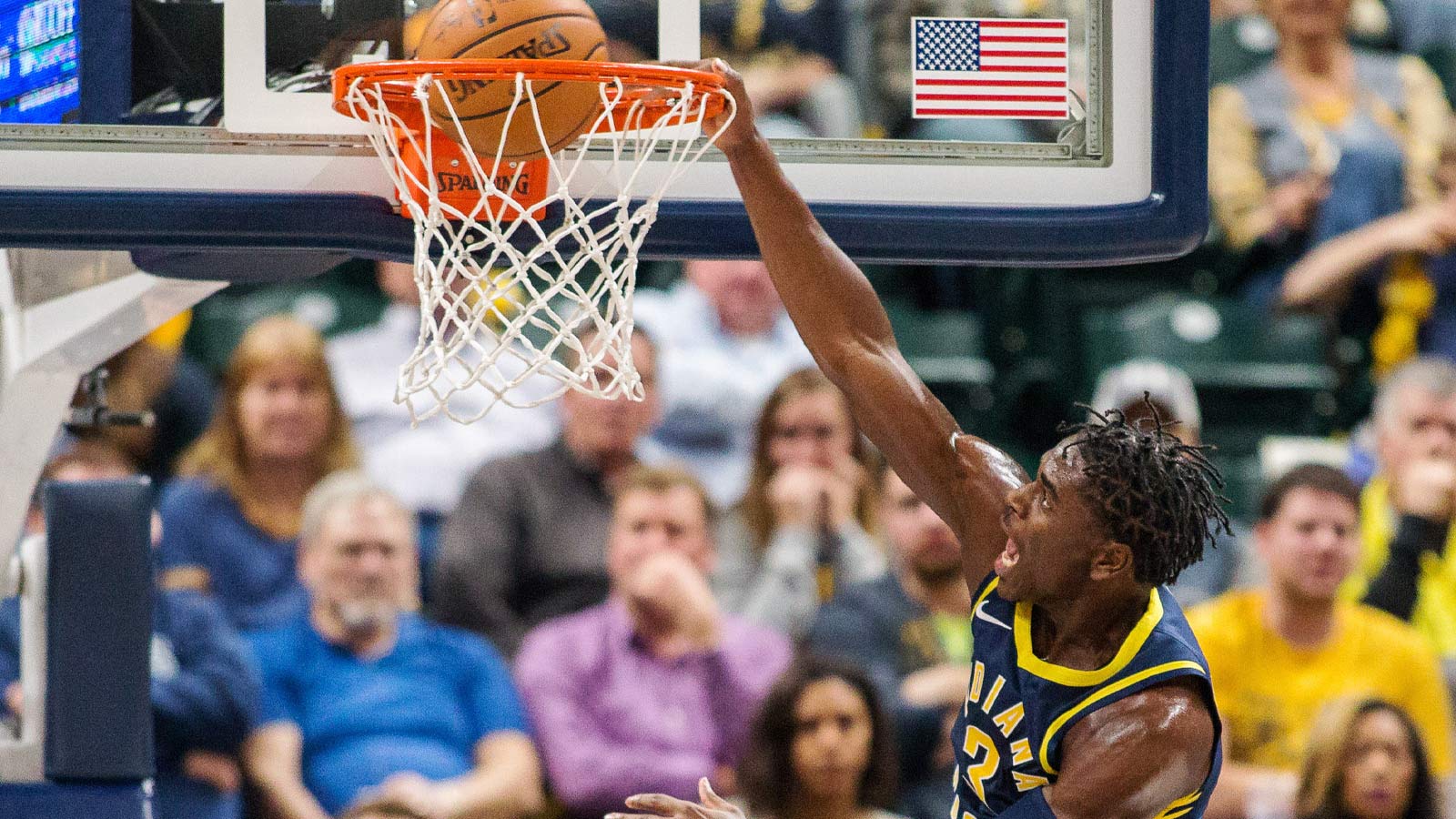Indiana Pacers guard Aaron Holiday (3) dunks the ball in the second half against the Utah Jazz at Bankers Life Fieldhouse.
