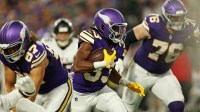 Minnesota Vikings running back Aaron Jones Sr. (33) runs the ball during the first half against the Atlanta Falcons at U.S. Bank Stadium.