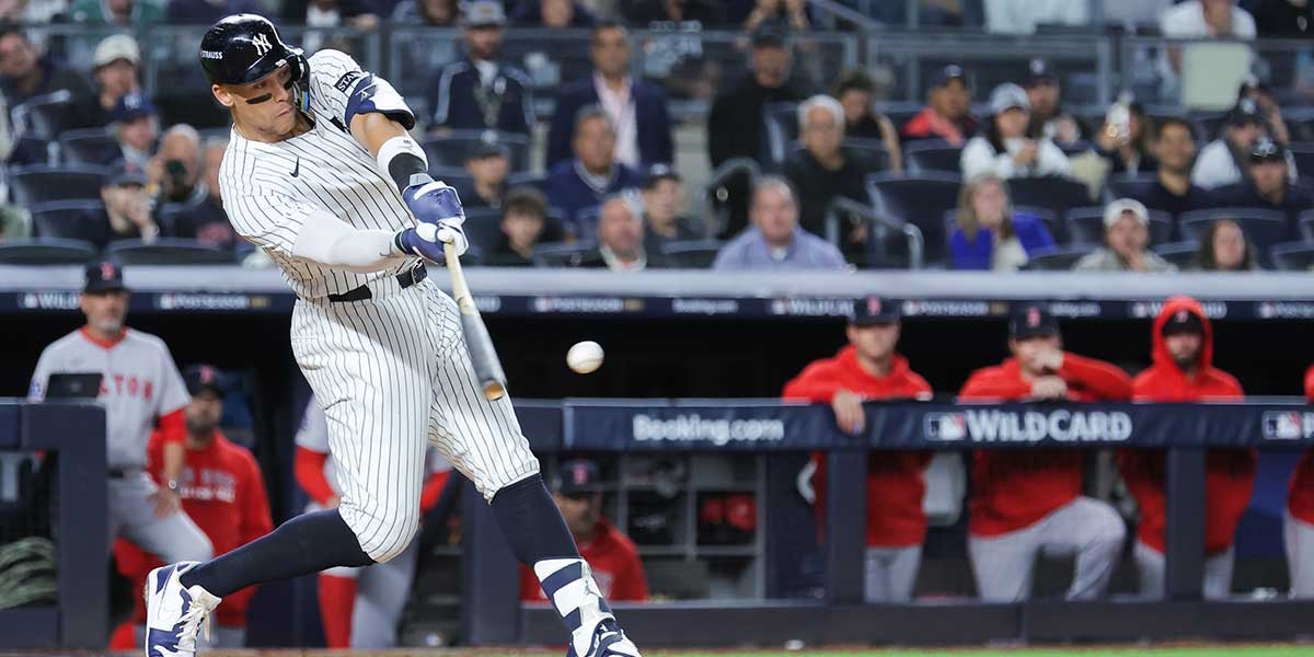 New York Yankees right fielder Aaron Judge (99) hits an hits an RBI single during the fifth inning against the Boston Red Sox during game two of the Wildcard round for the 2025 MLB playoffs at Yankee Stadium. 