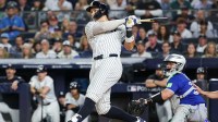 New York Yankees outfielder Aaron Judge (99) hits an RBI double in the third inning against the Toronto Blue Jays during game three of the ALDS round for the 2025 MLB playoffs at Yankee Stadium.