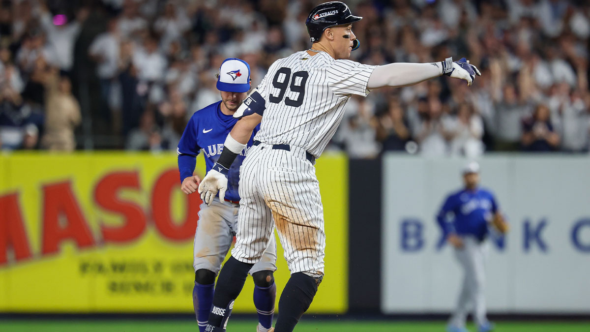 New York Yankees outfielder Aaron Judge (99) reacts after hitting an RBI double in the third inning against the Toronto Blue Jays during game three of the ALDS round for the 2025 MLB playoffs at Yankee Stadium.