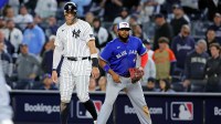 New York Yankees right fielder Aaron Judge (99) stands on first base with Toronto Blue Jays first baseman Vladimir Guerrero Jr. (27) during the ninth inning during game four of the ALDS round for the 2025 MLB playoffs at Yankee Stadium