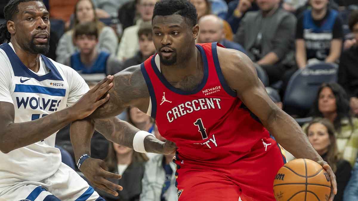 New Orleans Pelicans forward Zion Williamson (1) drives to the basket past Minnesota Timberwolves center Naz Reid (11) in the second half at Target Center.