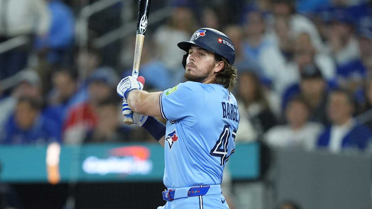 Toronto Blue Jays third baseman Addison Barger (47) hits a double against the Los Angeles Dodgers in the third inning during game six of the 2025 MLB World Series at Rogers Centre.