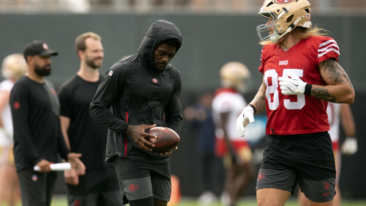 Still recovering from knee surgery, San Francisco 49ers wide receiver Brandon Aiyuk (left) hangs out with teammate George Kittle (85) during the second day of training camp